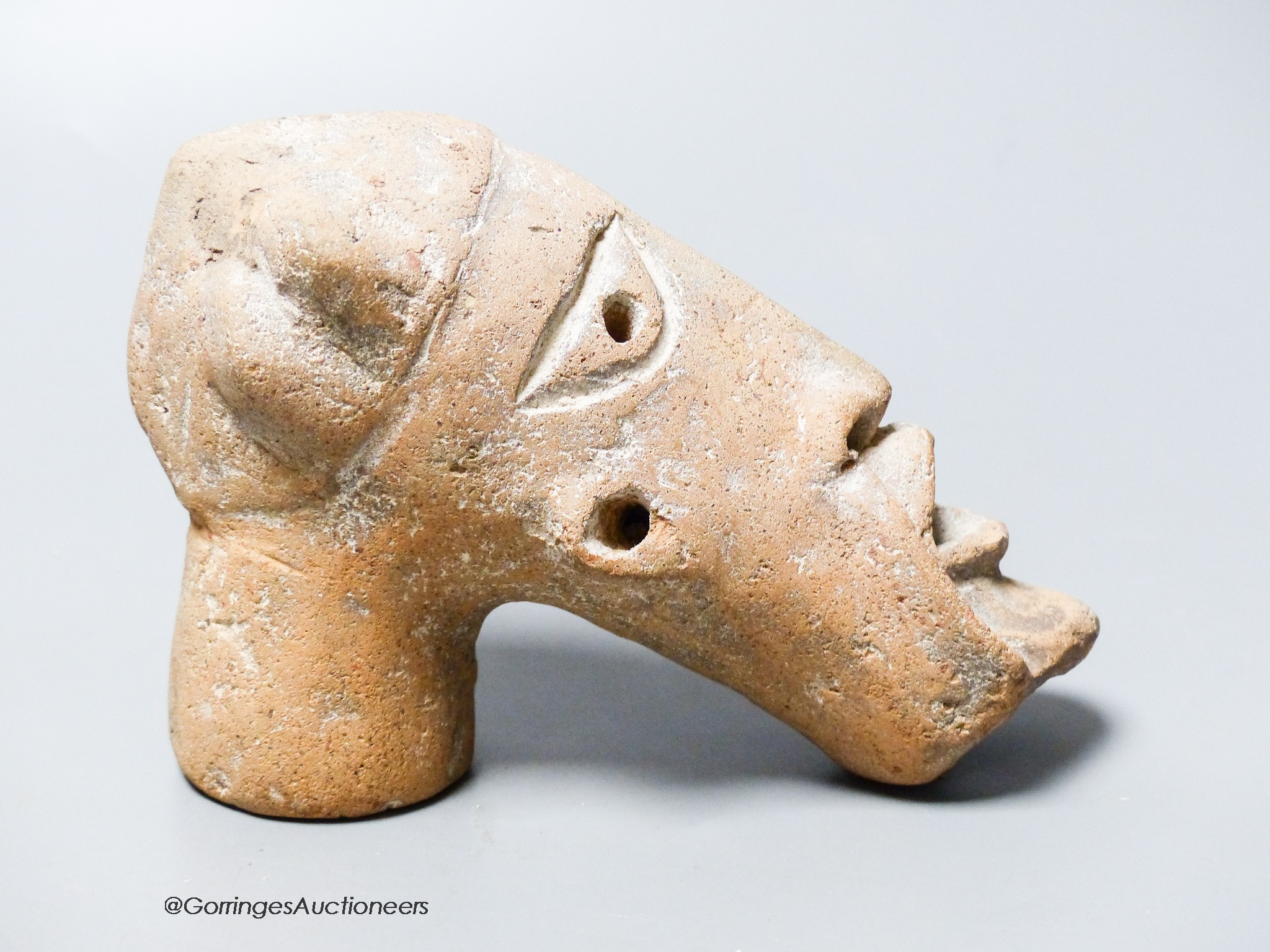 An African Tribal terracotta mask, length 16cm